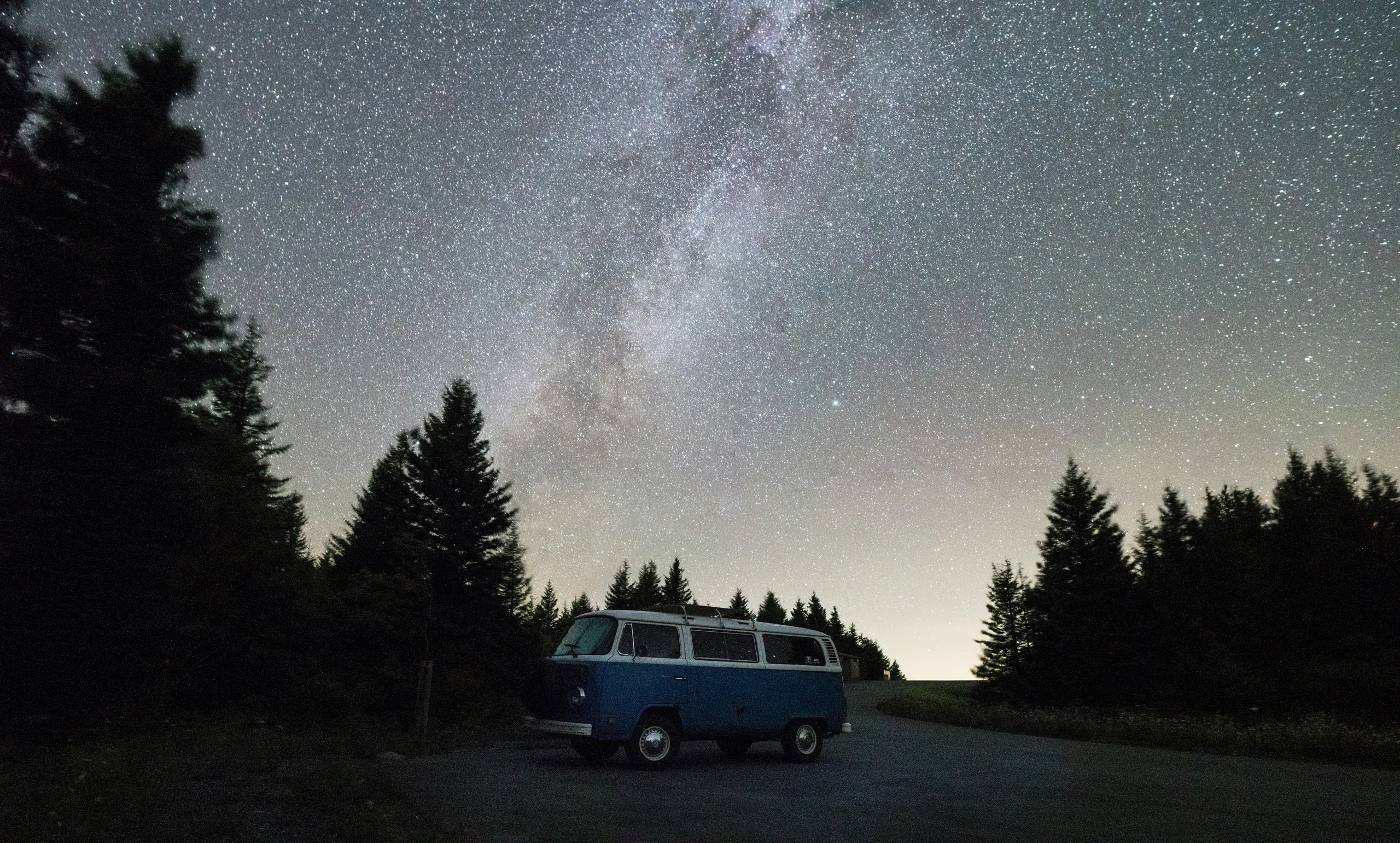 VW camper van under early morning starlight, Spruce Knob, West Virginia
