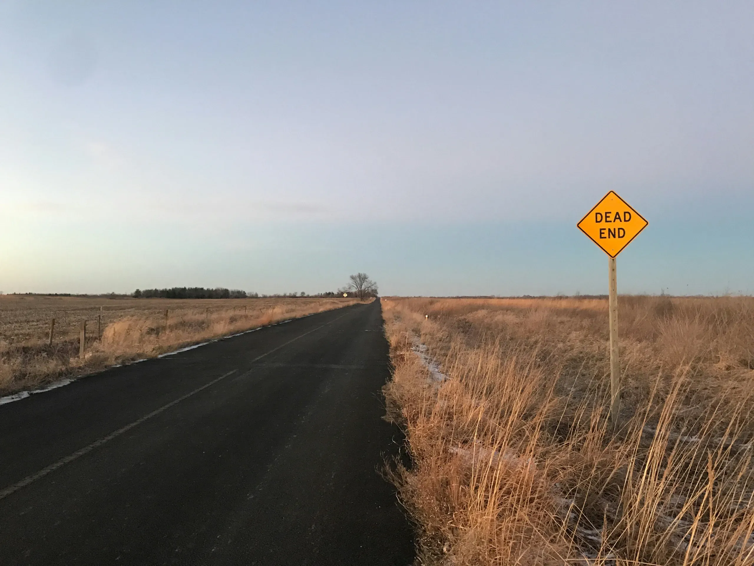 A dead end sign next to a country road, Iowa