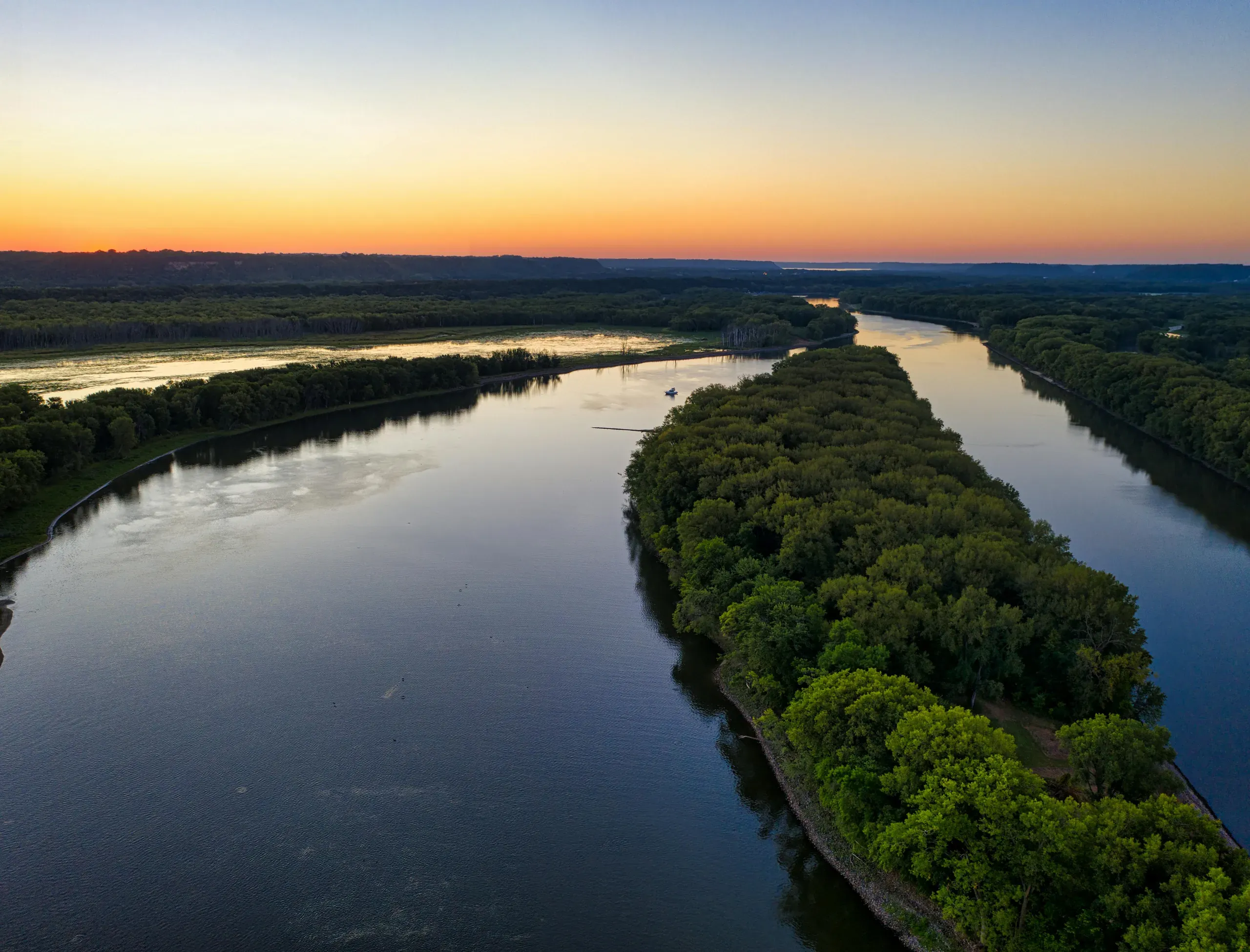 Welch, Mississippi. Aerial view of green trees beside the lake
