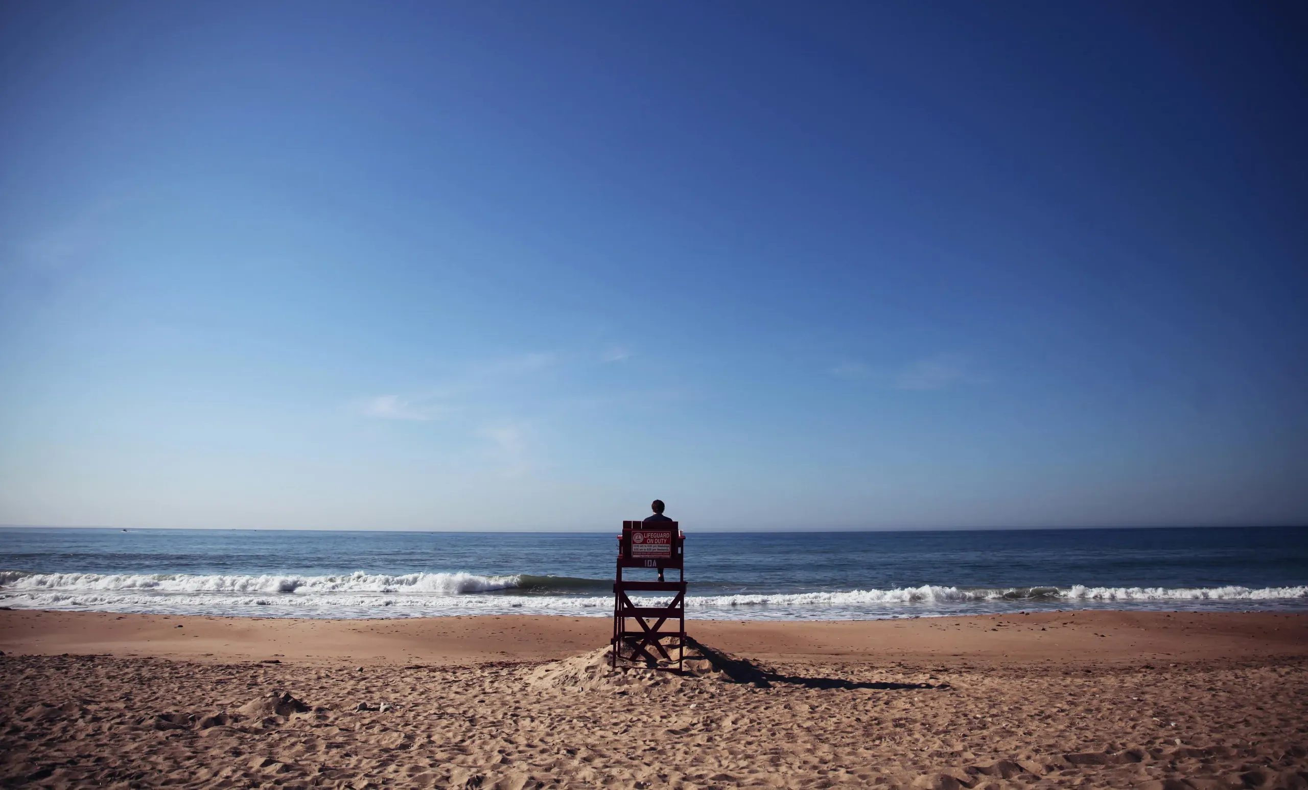 Rhode Island. Photo of person sitting on lifeguard tower