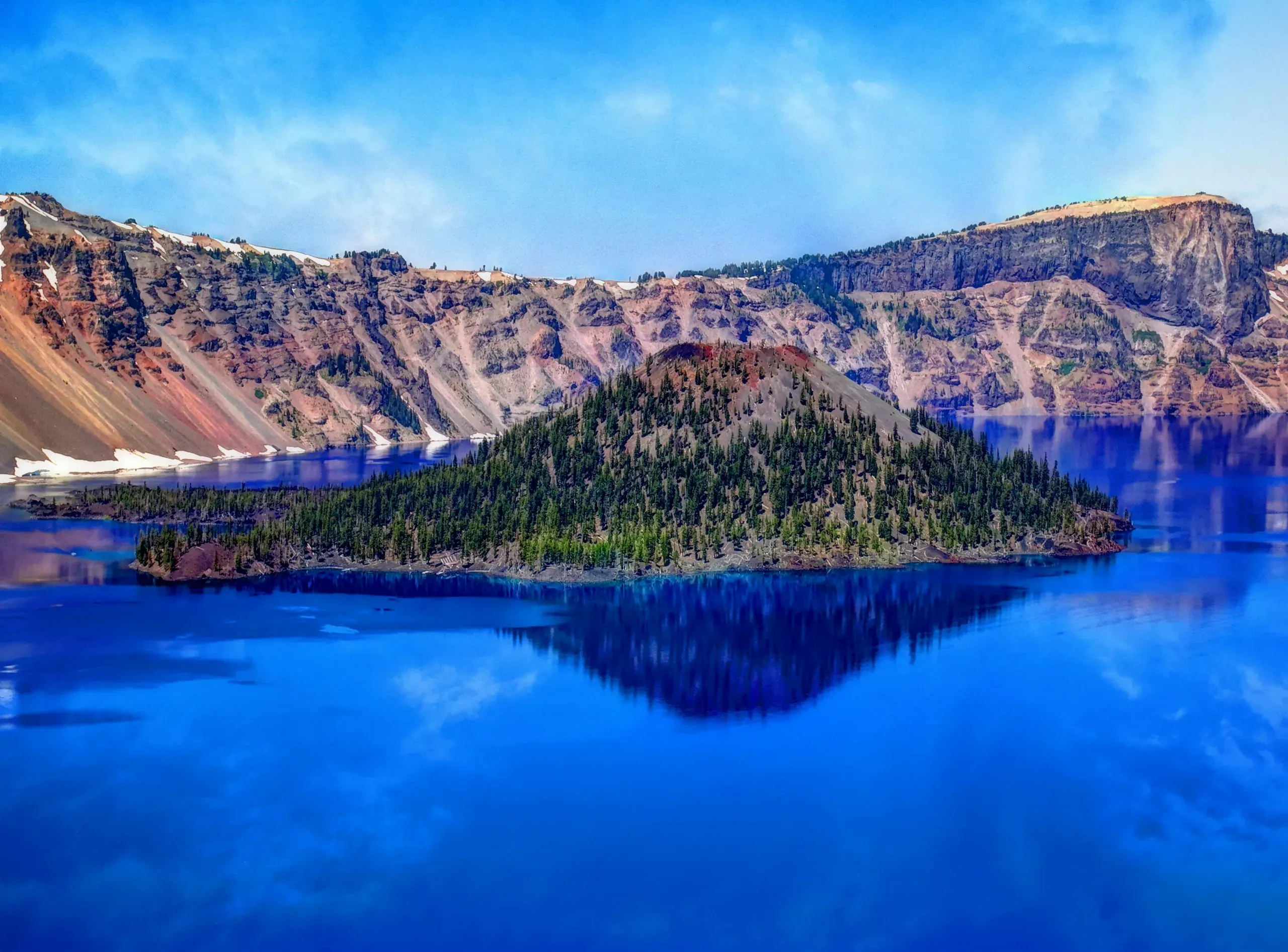 Crater Lake, Oregon. Island on blue water surrounded by moutain