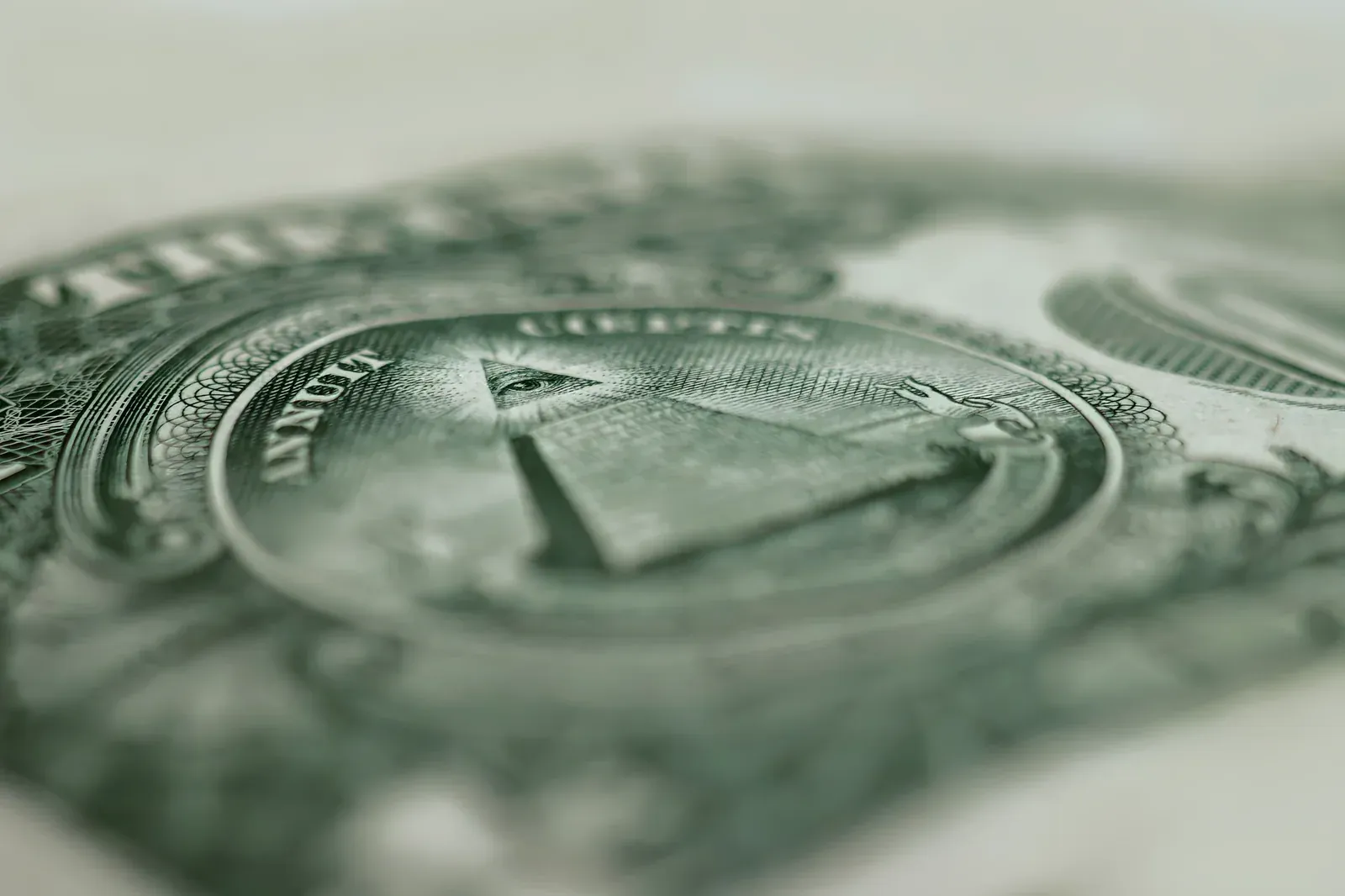 Extreme close-up of the all-seeing eye and pyramid on the back of a US one dollar bill