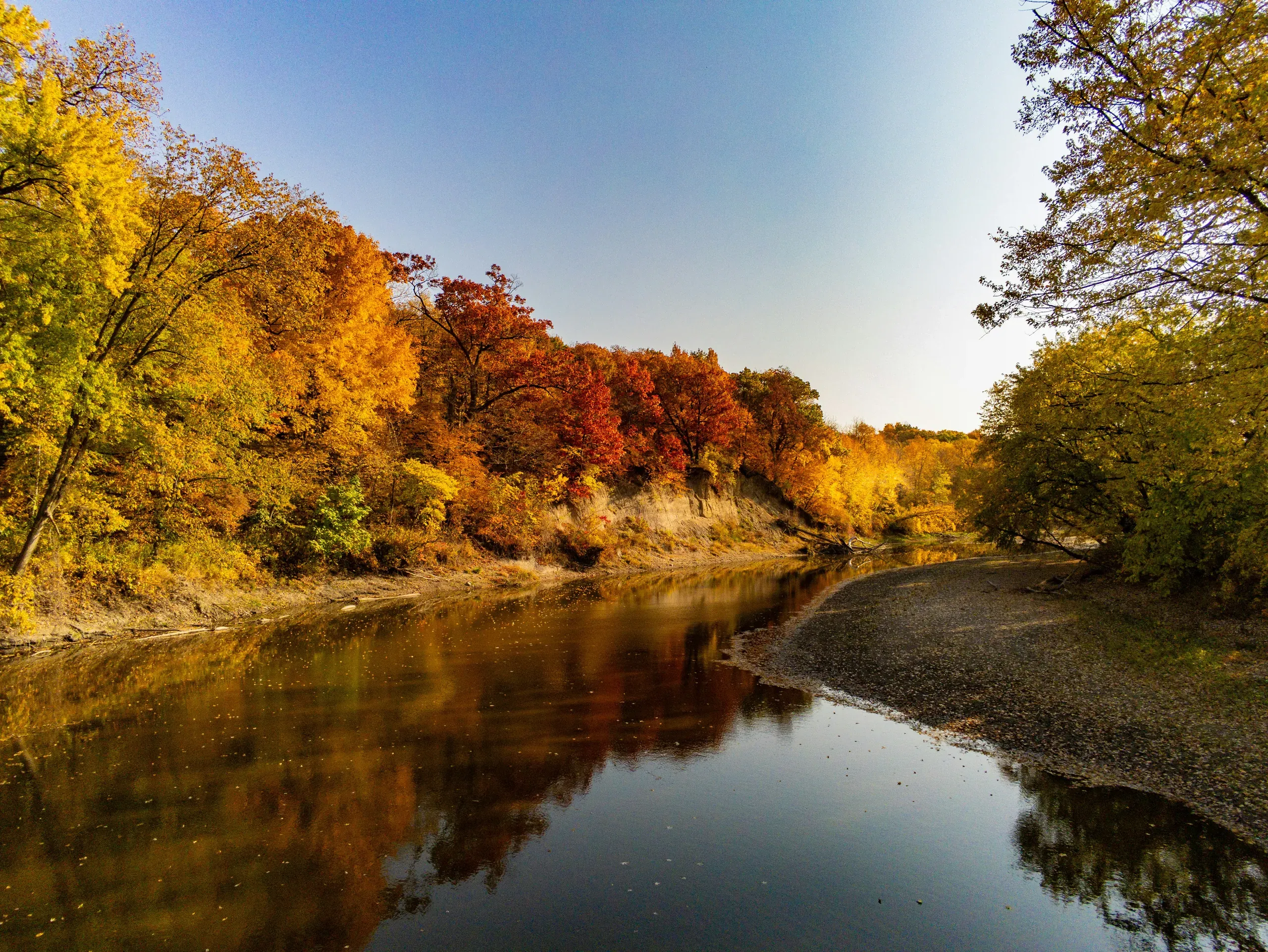 Boone River, Iowa. A drone view over a calm river in autumn.