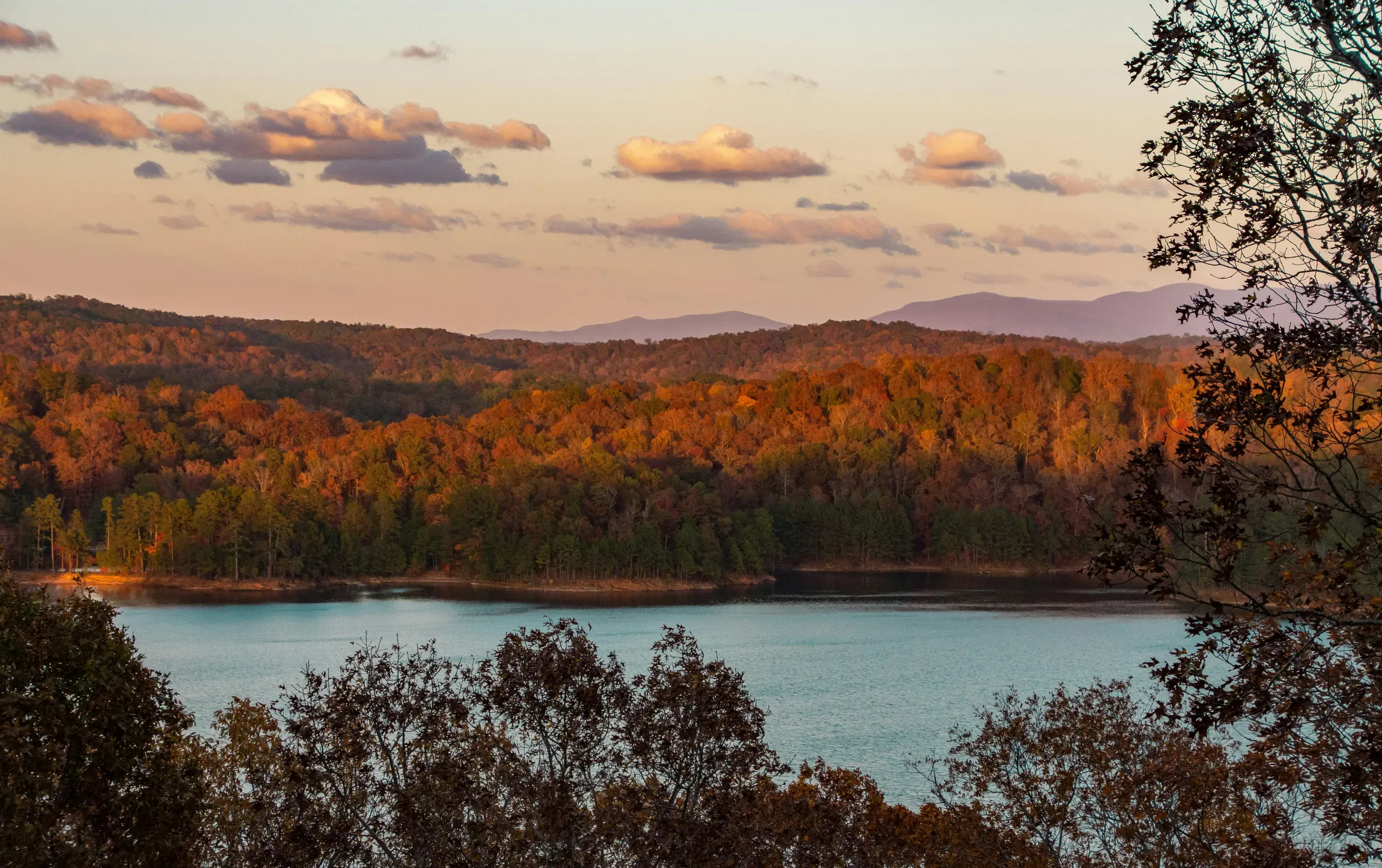 Carters Lake, Georgia. Golden autumn mountains surrounding Carter's Lake Dam, shot at sunset.