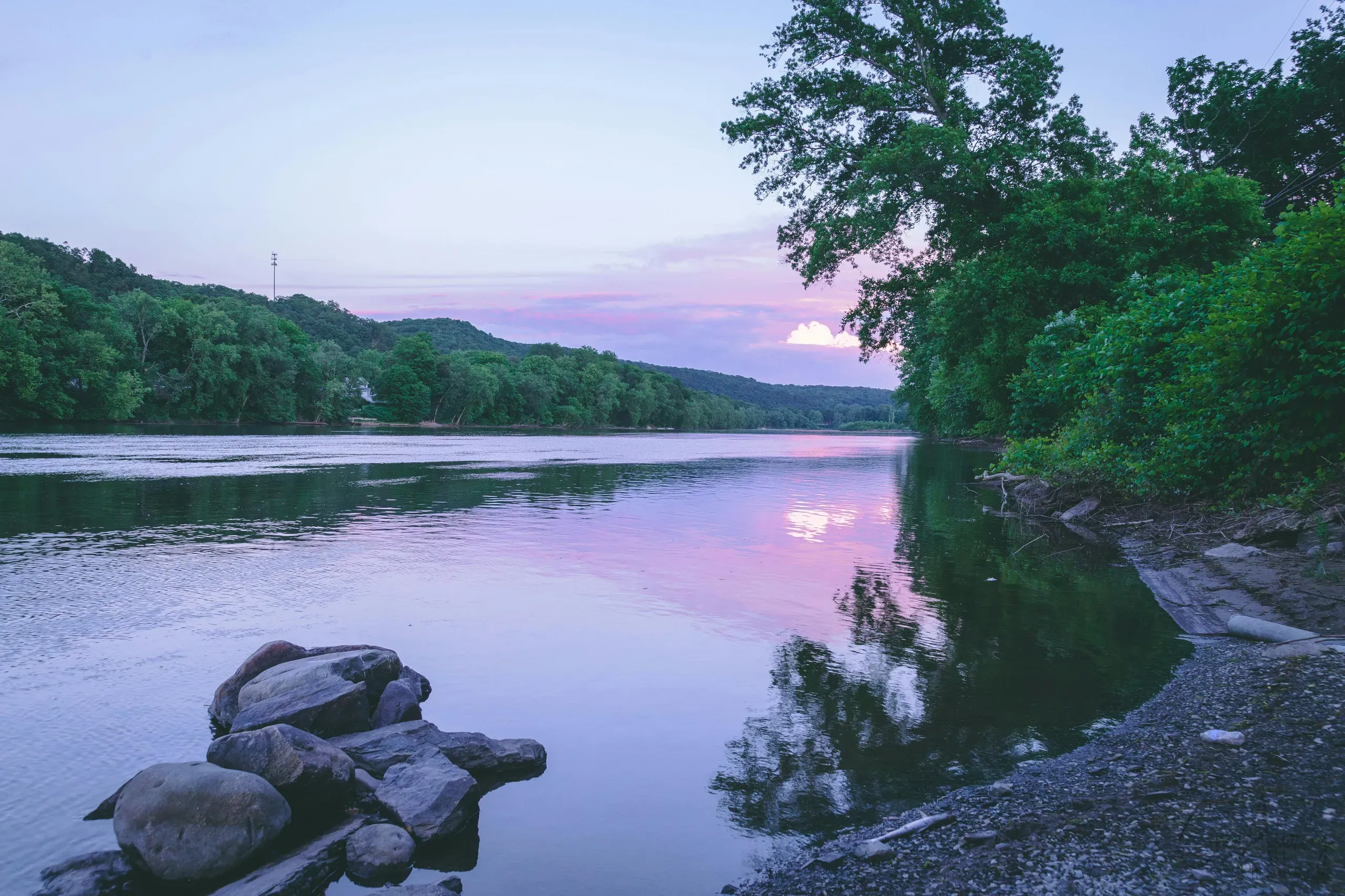 Mount Bethel, Pennsylvania. Calm body of water near rocks and trees