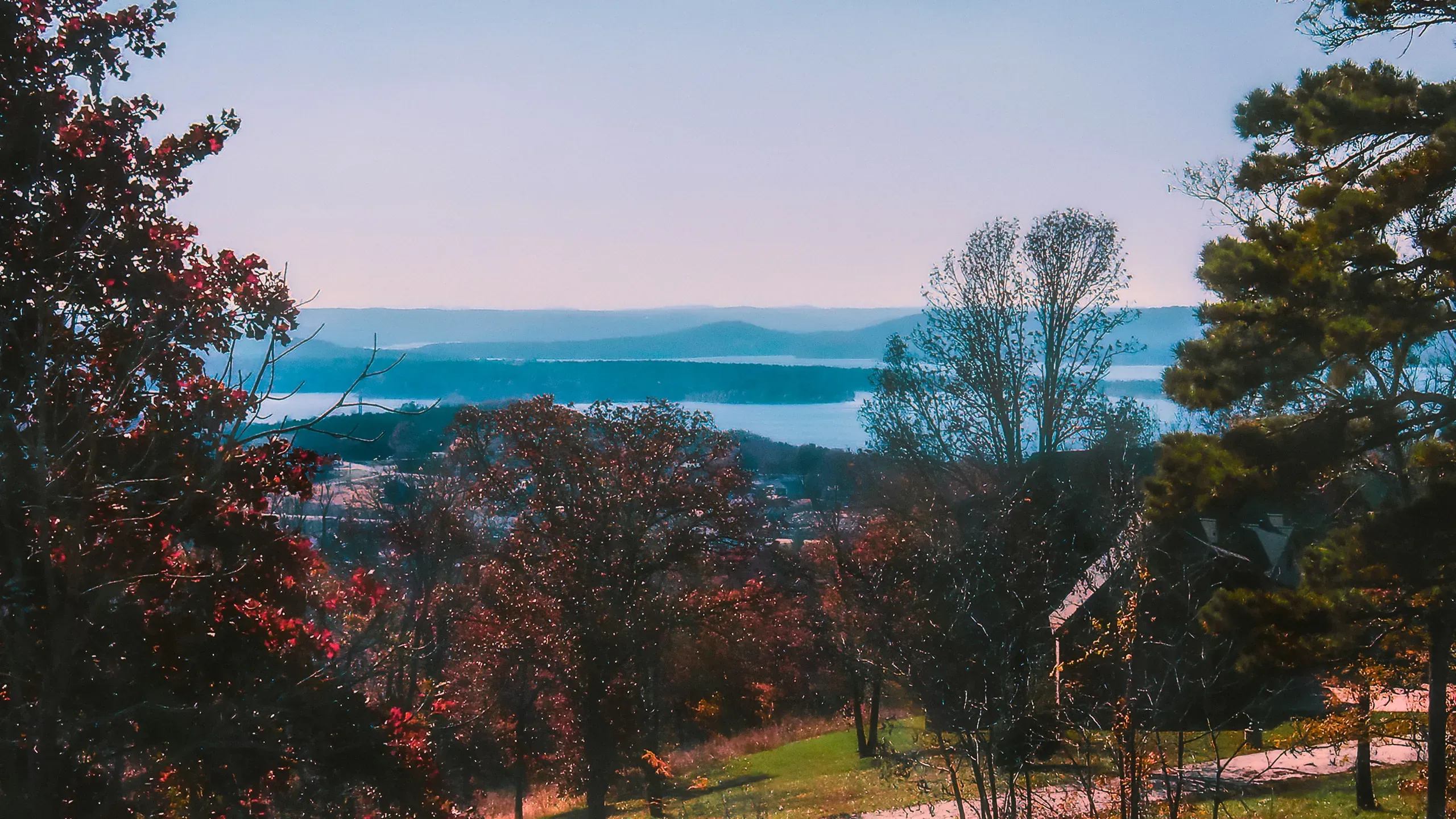 Remnants of morning fog remain over Table Rock Lake on an autumn morning in Branson, Missouri