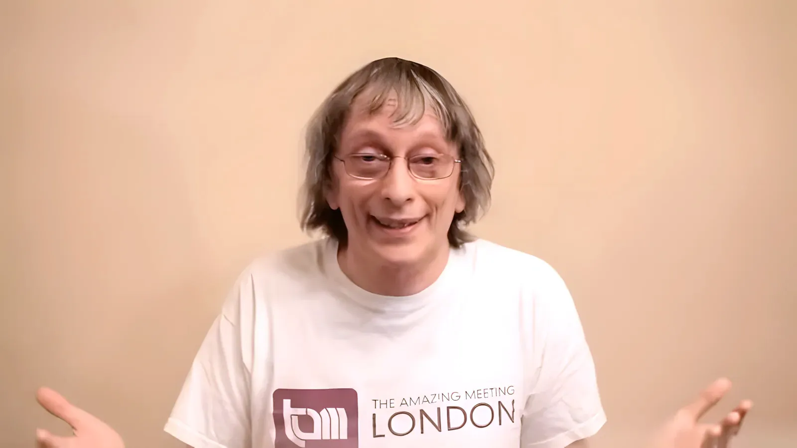 David Deutsch wearing a 'The Amazing Meeting London' t-shirt