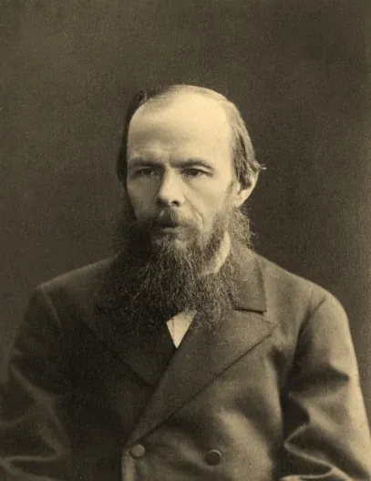 Sepia photographic portrait of Fyodor Dostoevsky with a long beard, taken in 1879