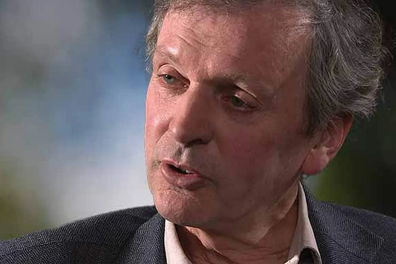 Close-up portrait of Rupert Sheldrake speaking
