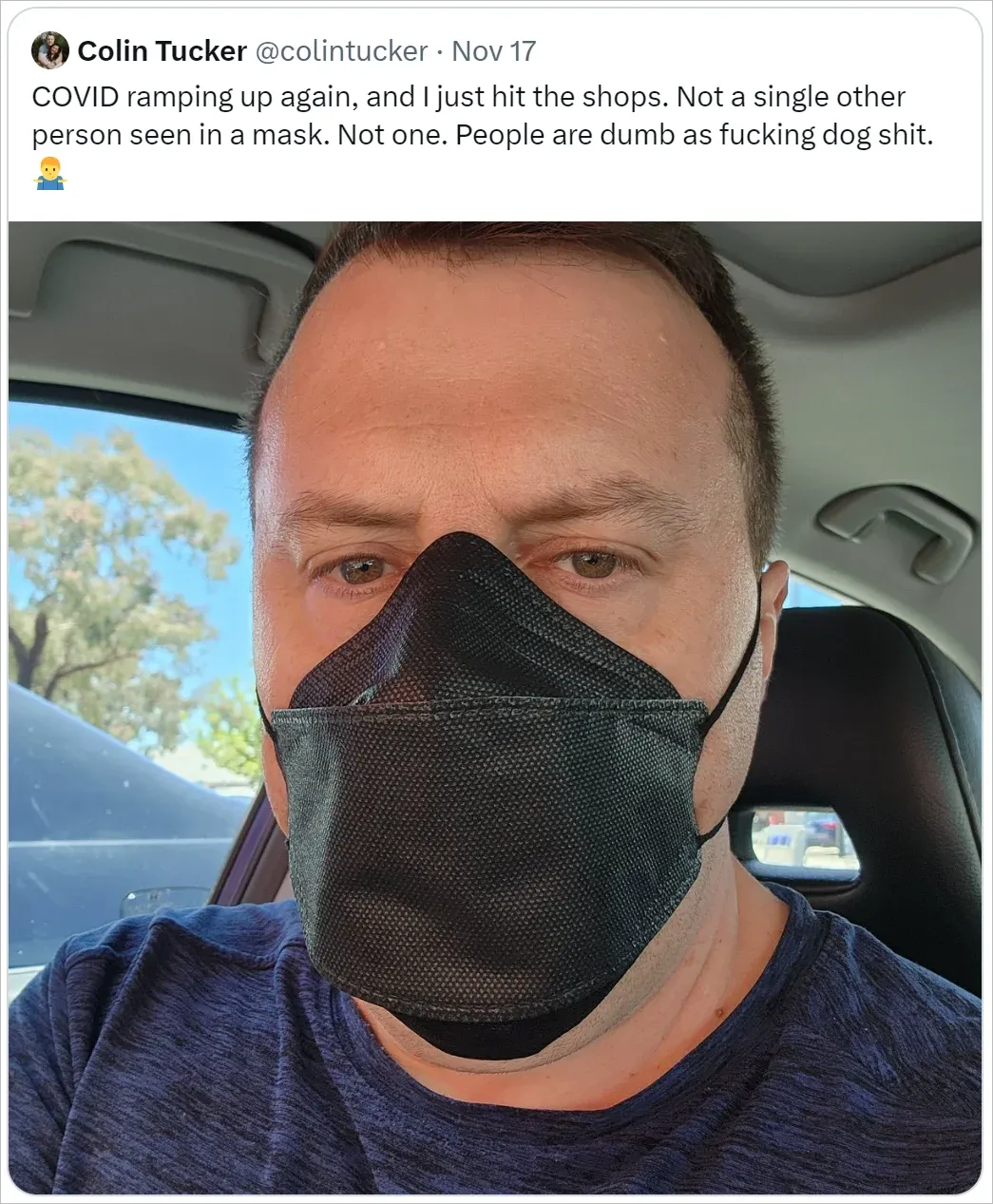 Tweet from Colin Tucker wearing black N95 mask in his car, angry that nobody else in shops is wearing masks
