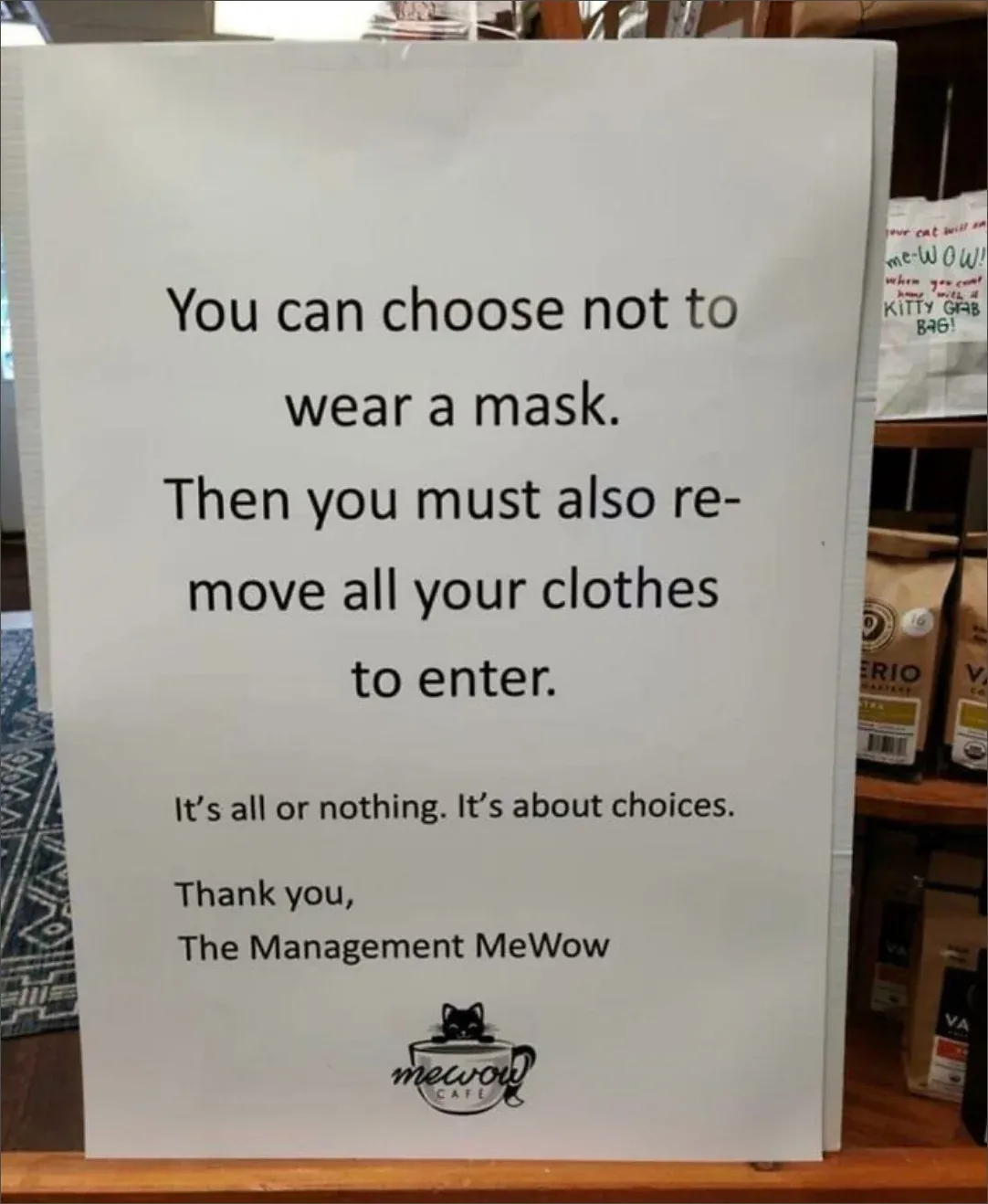 Sign at MeWow Cafe: You can choose not to wear a mask. Then you must also remove all your clothes to enter. It's all or nothing. It's about choices.