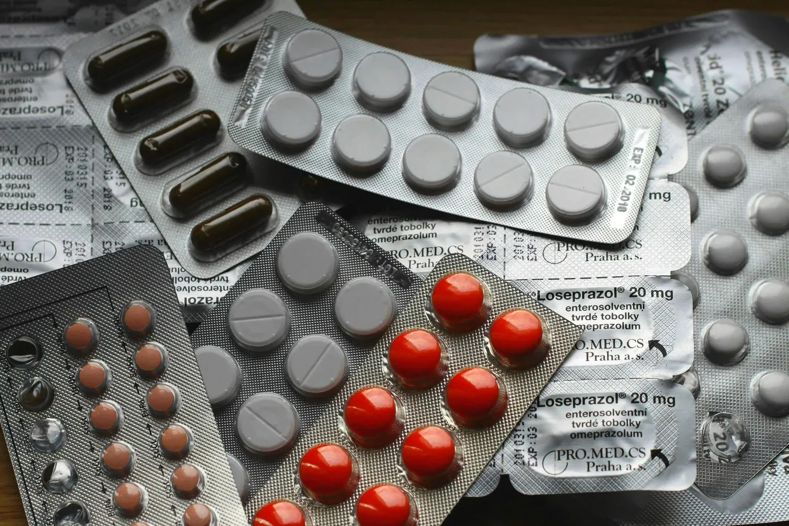 A pile of blister packs of various pills and tablets