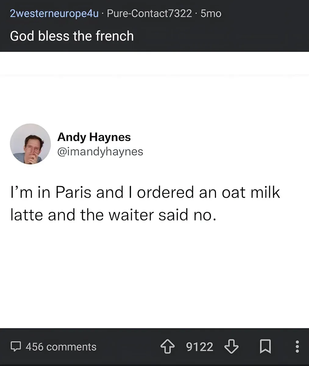 Reddit post from r/2westerneurope4u by PureContact7322 (5mo). Title: "God bless the french". Embedded tweet from Andy Haynes @imandyhaynes (hand covering face): "I'm in Paris and I ordered an oat milk latte and the waiter said no."