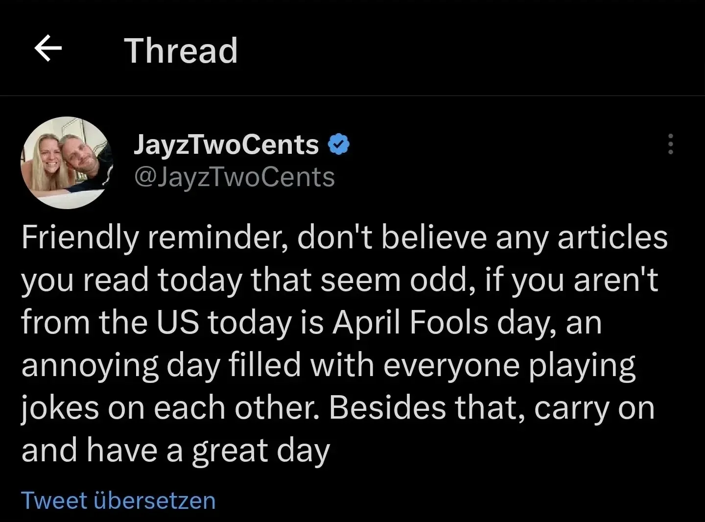 X/Twitter thread with German-language interface ("Tweet ubersetzen"). Thread header. JayzTwoCents (@JayzTwoCents, verified, couple's): "Friendly reminder, don't believe any articles you read today that seem odd, if you aren't from the US today is April Fools day, an annoying day filled with everyone playing jokes on each other. Besides that, carry on and have a great day"