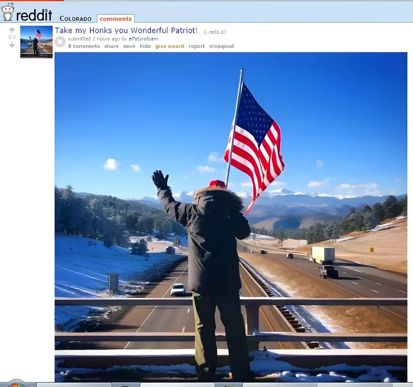 Reddit post from r/Colorado (old Reddit interface). Title: "Take my Honks you Wonderful Patriot!" Submitted 2 hours ago by u/RichardBaker. Photo of a person standing on a highway overpass in winter, arms raised, holding a large American flag over the snowy mountain road below.