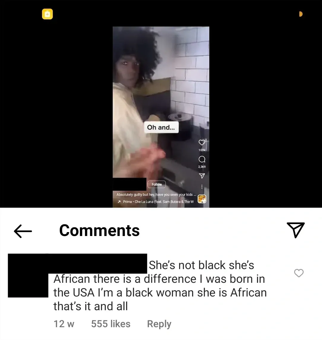 Instagram screenshot. TikTok/Reels video of a black woman with curly hair in a kitchen, text overlay "Oh and...". Caption: "Absolutely guilty but hey, have you seen your kids..." Comment below (username redacted, 12w): "She's not black she's African there is a difference I was born in the USA I'm a black woman she is African that's it and all"