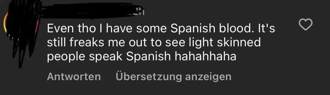 TikTok/Instagram comment (username redacted, 2h). Text: "Even tho I have some Spanish blood. It's still freaks me out to see light skinned people speak Spanish hahahhaha". German-language interface (Antworten, Ubersetzung anzeigen)