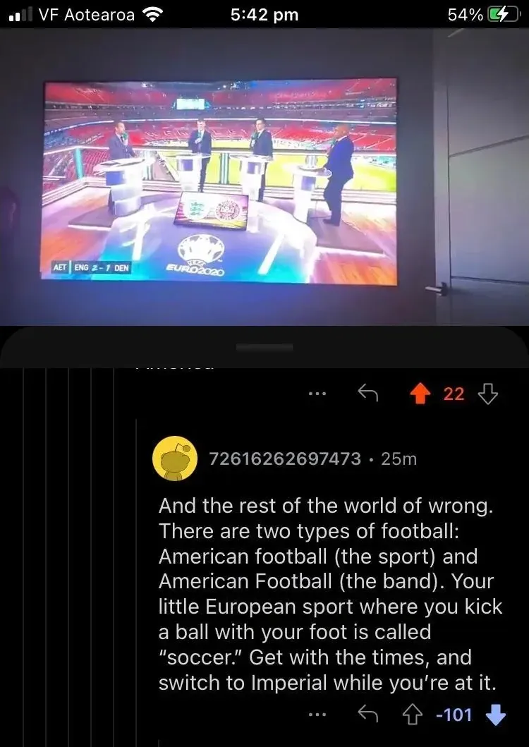 Reddit comment thread (mobile, VF Aotearoa carrier, 5:42 pm). Photo of Euro 2020 TV coverage showing pundits at Wembley with scoreboard "AET ENG 2-1 DEN" and Euro 2020 logo. Reply from 72616262697473 (25m, -101): "And the rest of the world of wrong. There are two types of football: American football (the sport) and American Football (the band). Your little European sport where you kick a ball with your foot is called 'soccer.' Get with the times, and switch to Imperial while you're at it."