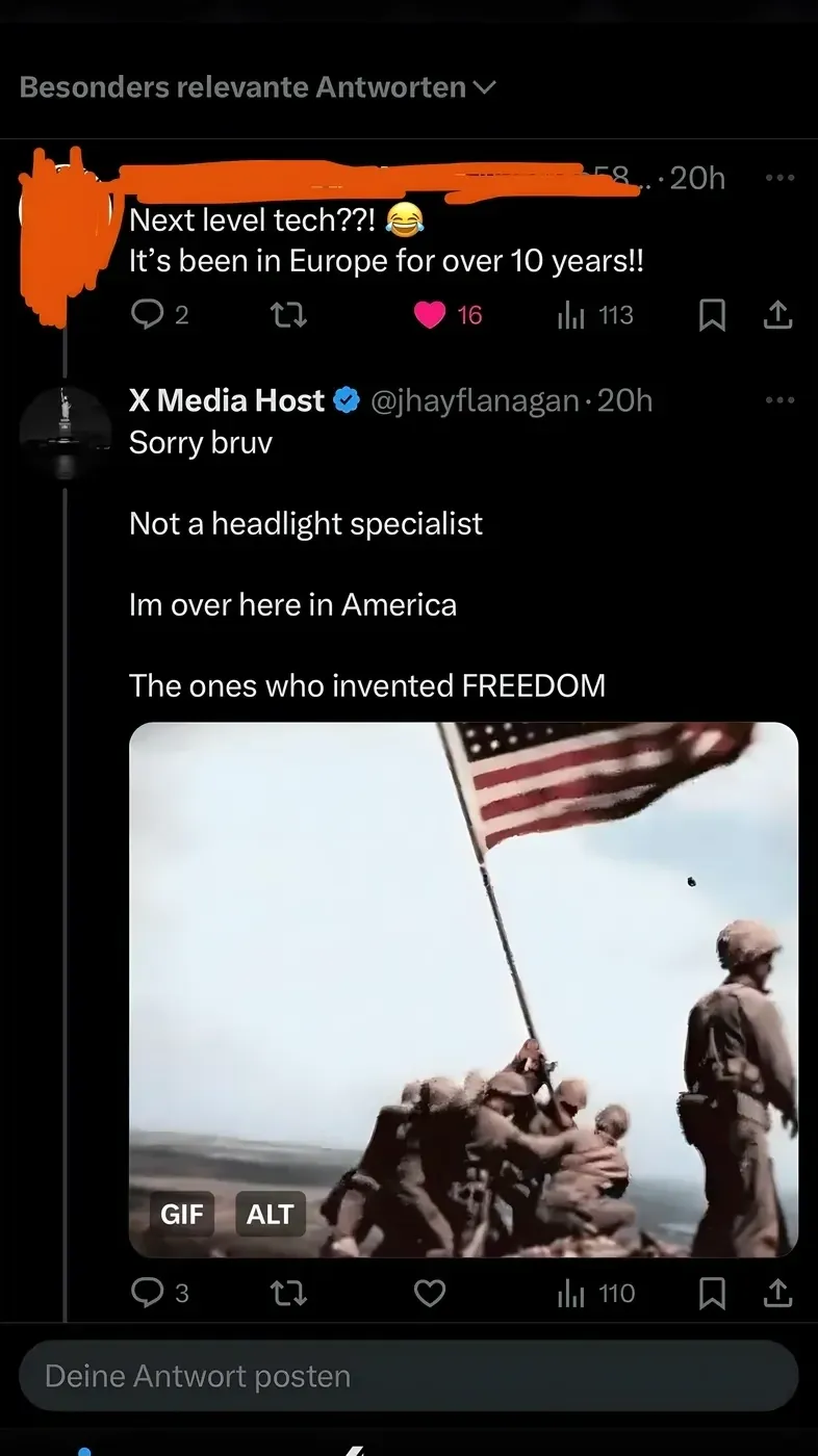 X/Twitter thread (German interface). Reply: Next level tech! It's been in Europe for over 10 years!! Reply from X Media Host @jhayflanagan: Sorry bruv. Not a headlight specialist. Im over here in America. The ones who invented FREEDOM - with Iwo Jima flag-raising GIF