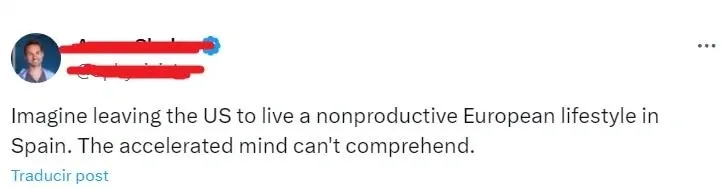 Twitter/X post (verified user, username and username redacted). "Imagine leaving the US to live a nonproductive European lifestyle in Spain. The accelerated mind can't comprehend." with "Traducir post" link below (Spanish interface)