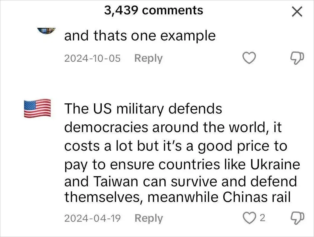 TikTok comment section. Two comments. First (2024-10-05): "and thats one example". Second (American flag emoji avatar, 2024-04-19): "The US military defends democracies around the world, it costs a lot but it's a good price to pay to ensure countries like Ukraine and Taiwan can survive and defend themselves, meanwhile Chinas rail" (text cut off).