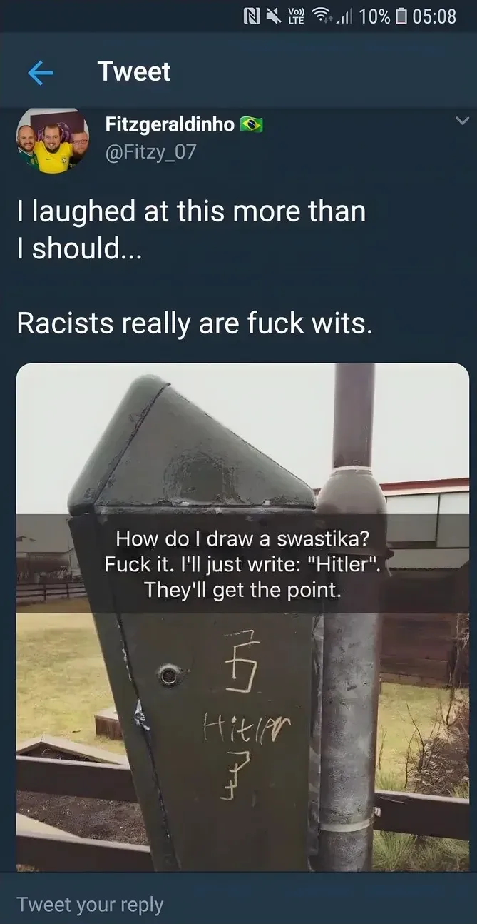 Fitzgeraldinho @Fitzy_07 tweet - I laughed at this more than I should... Racists really are fuck wits. Photo of graffiti on a metal post with a badly drawn swastika and the word Hitler, captioned How do I draw a swastika? Fuck it. I'll just write Hitler. They'll get the point