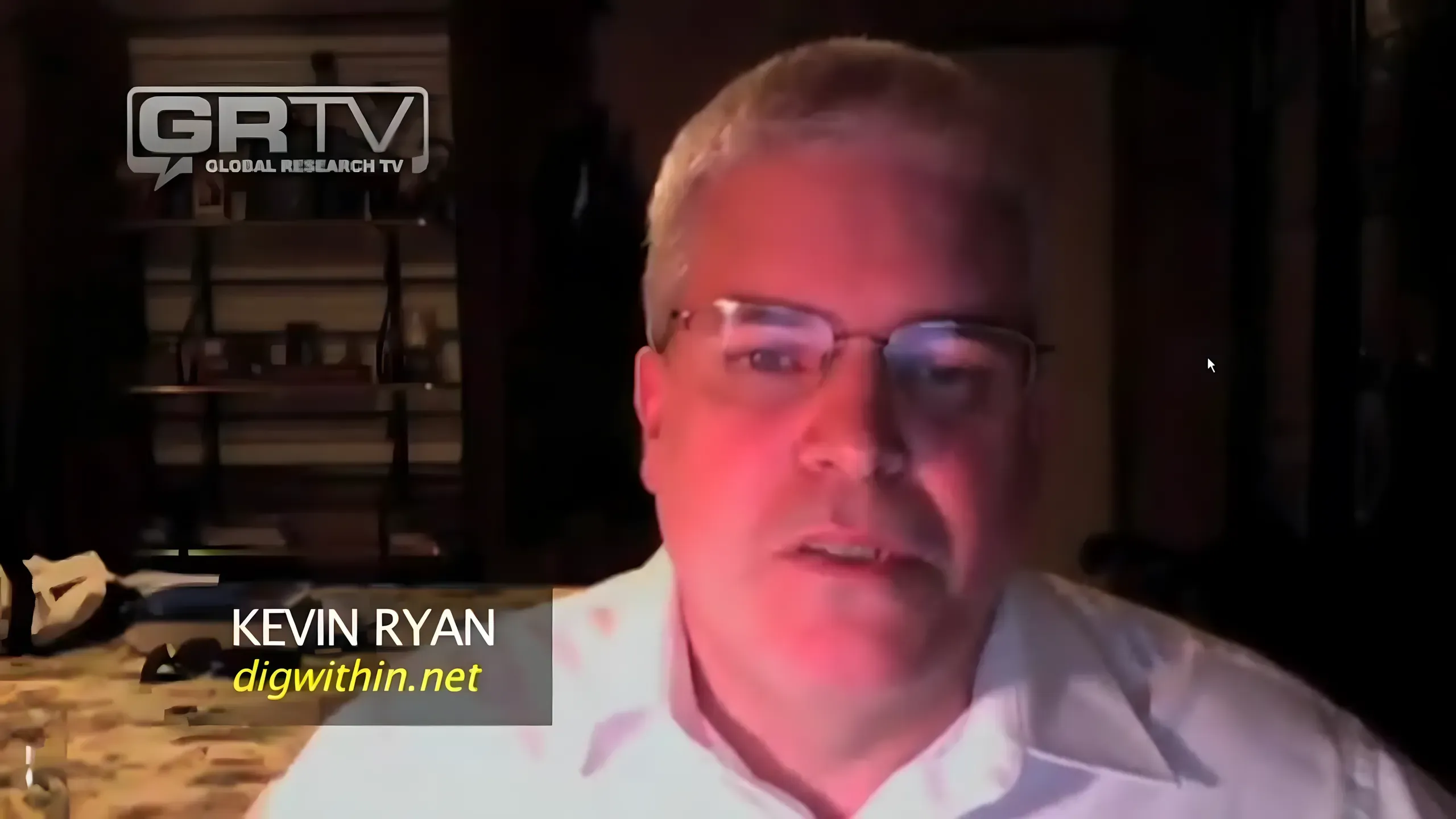 Kevin Ryan speaking via webcam on Global Research TV (GRTV), wearing glasses and a white shirt, with digwithin.net caption