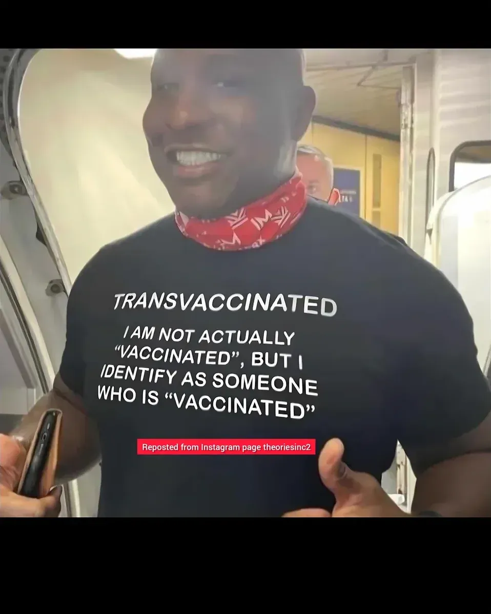 Man wearing TRANSVACCINATED t-shirt on subway