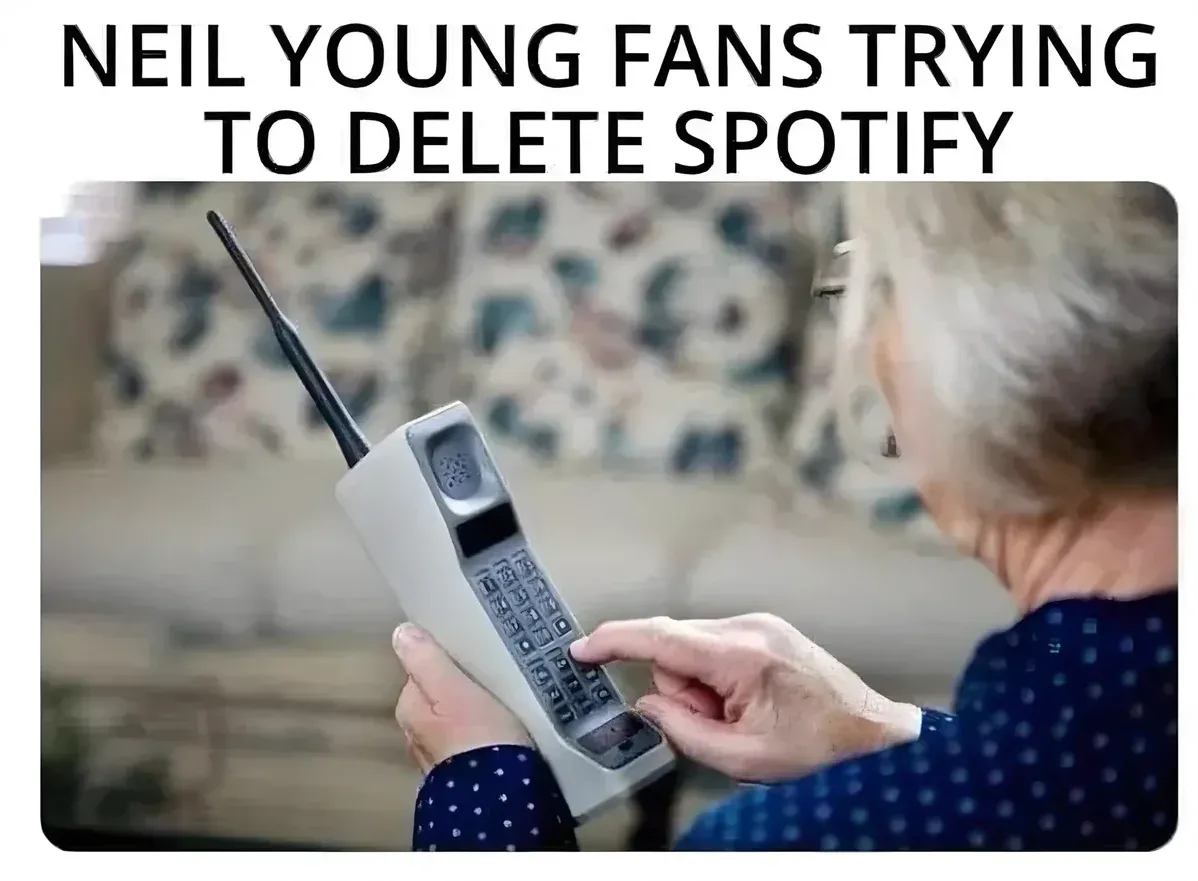 Neil Young fans trying to delete Spotify meme - elderly person with old phone